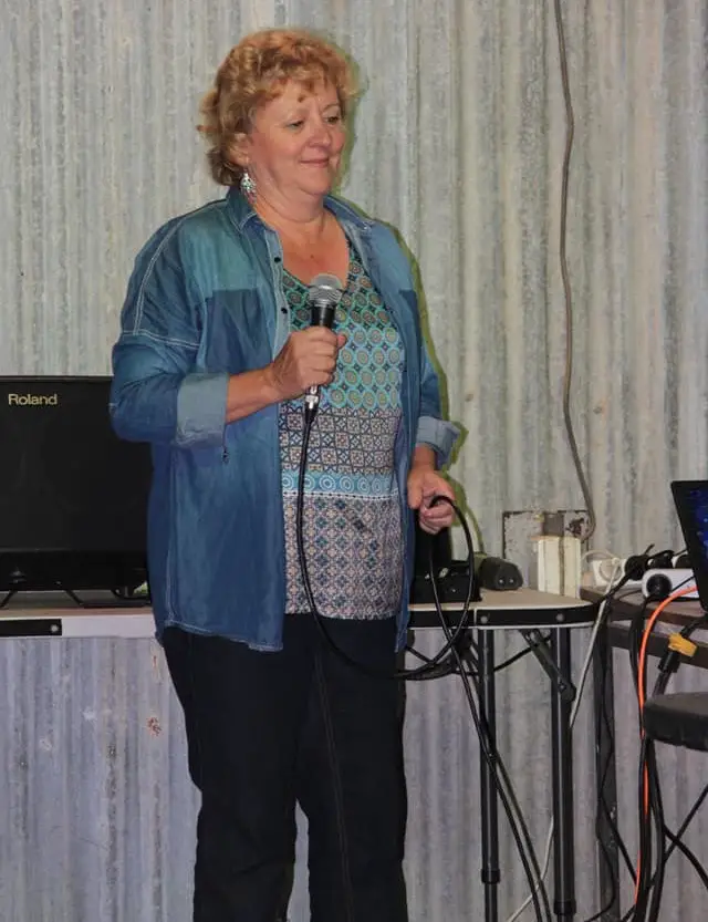 lady leading the sing-along session for seniors in aged care