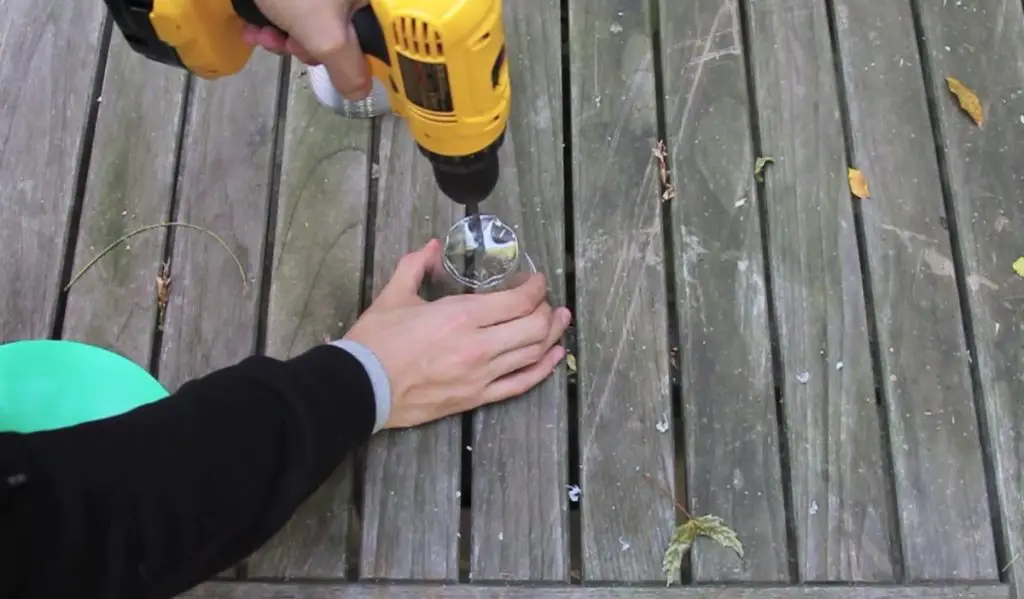 Drilling a hole to a cup