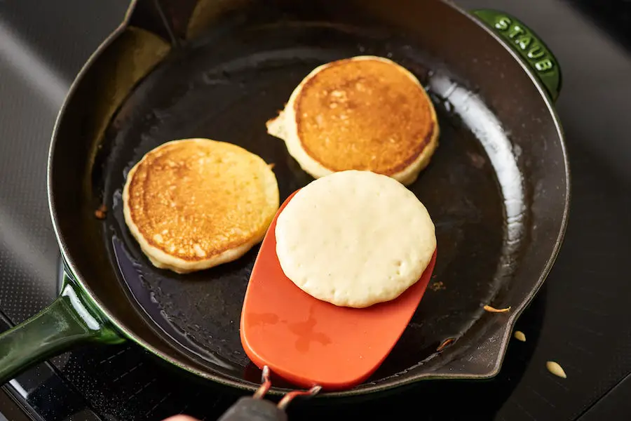 Pancakes being cooked in a frypan 