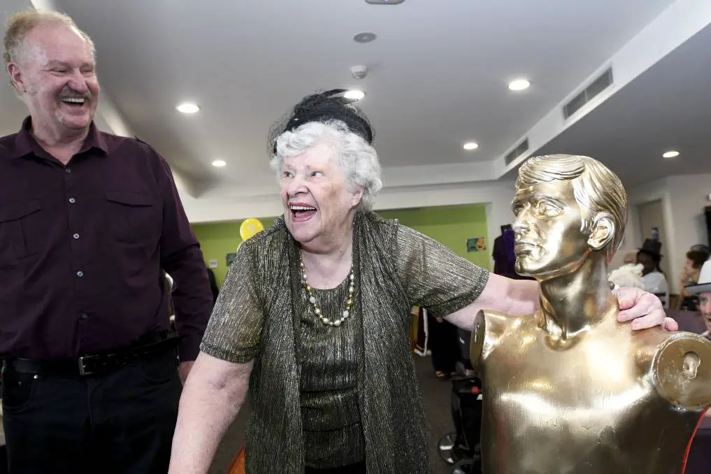 elderly people smiling happily in their oscars event
