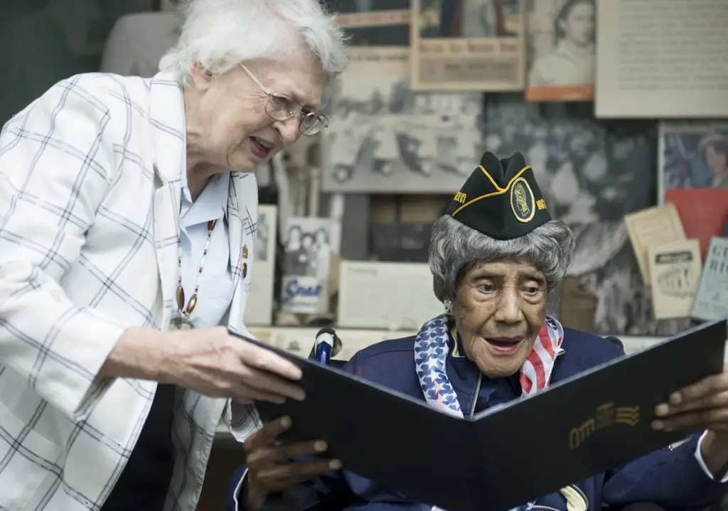 War veteran women looking at old records