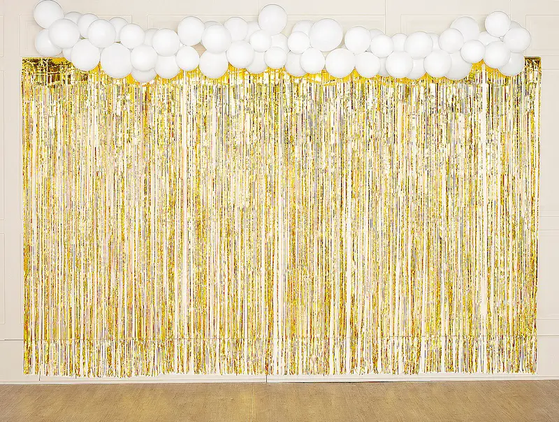 white balloons and metallic gold decorations for the betty white themed event