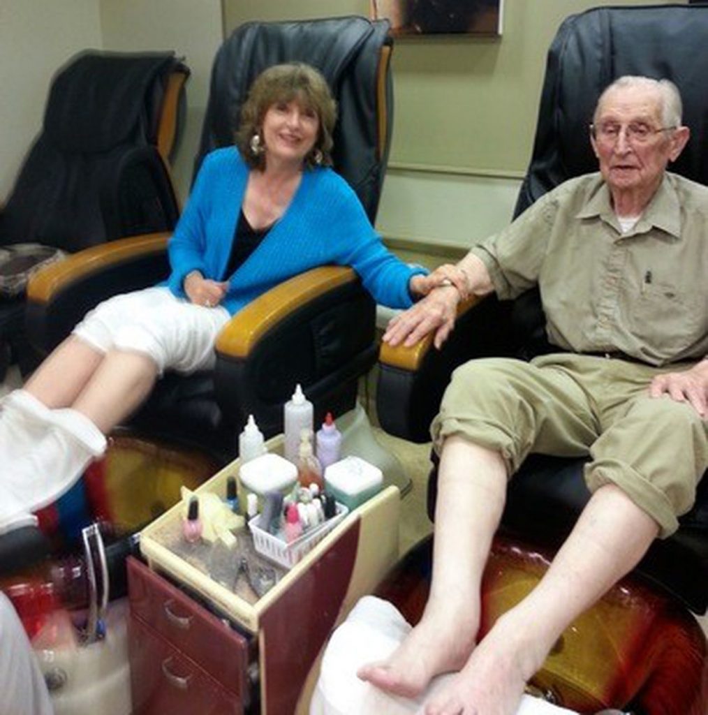 Seniors in aged care enjoying foot massage