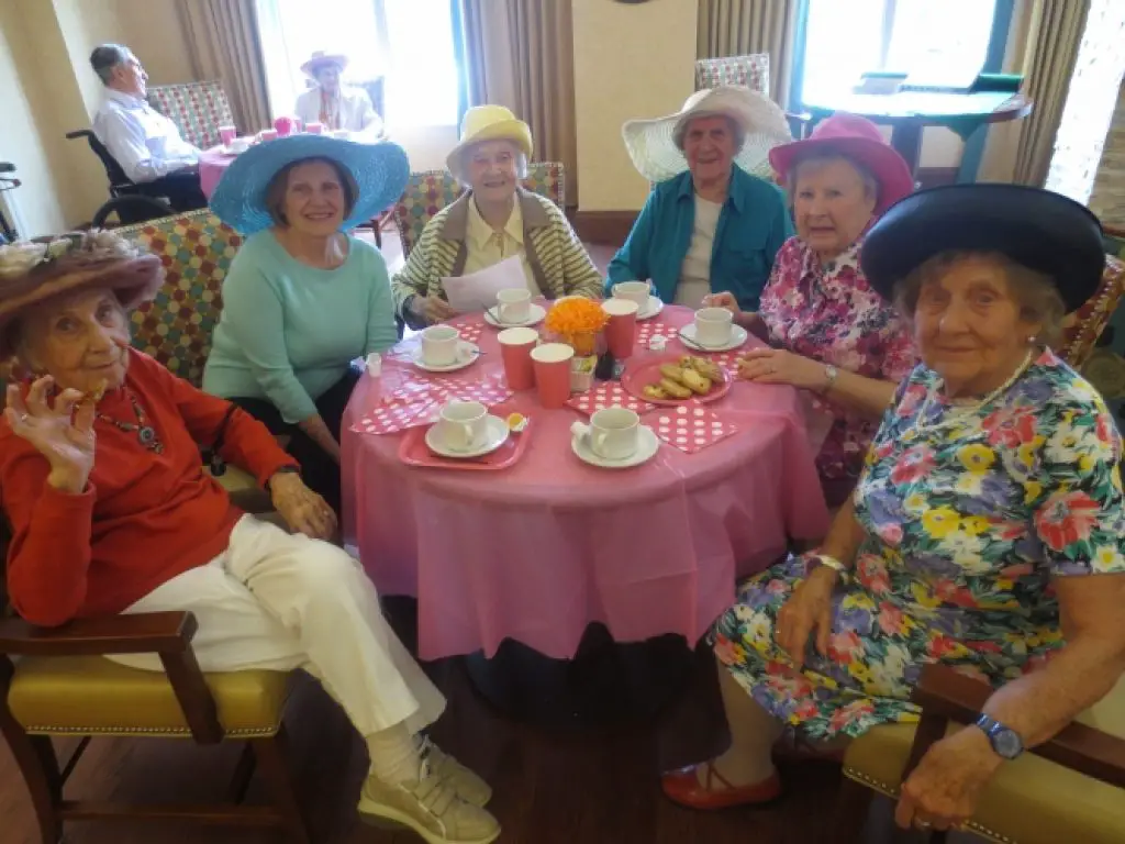 Elderly women dressed nicely for the Tupperware Party Activity