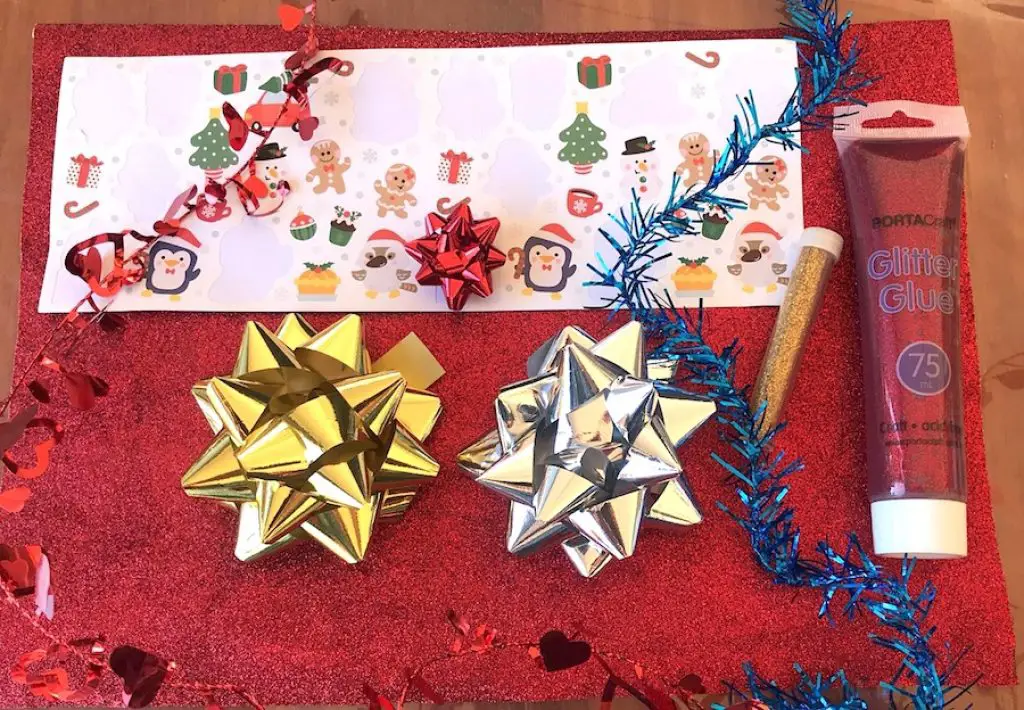 Ribbons, tinsels and glue used for Christmas decorations craft