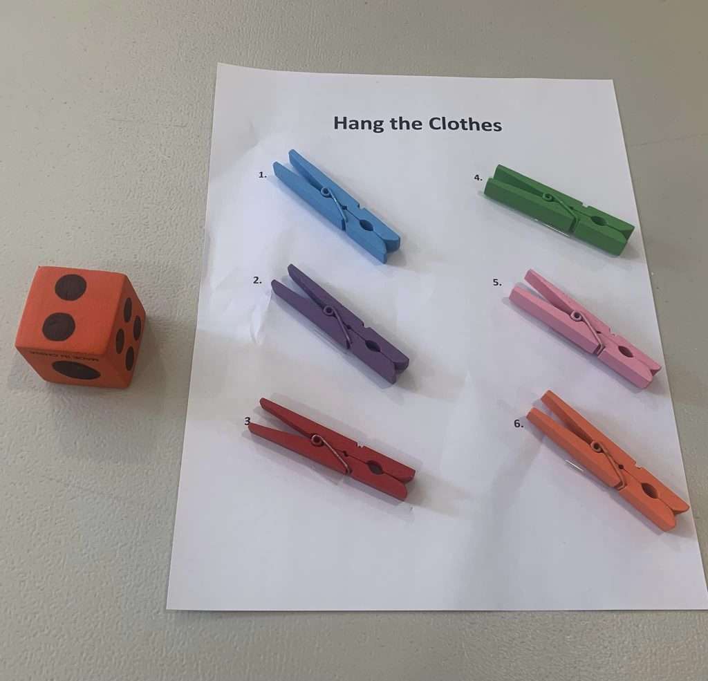 Colored clothes pegs placed and numbered