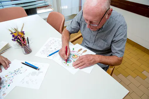 Seniors doing coloring activity