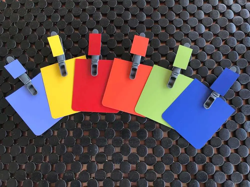 different colored clothes peg attached to their specified colors