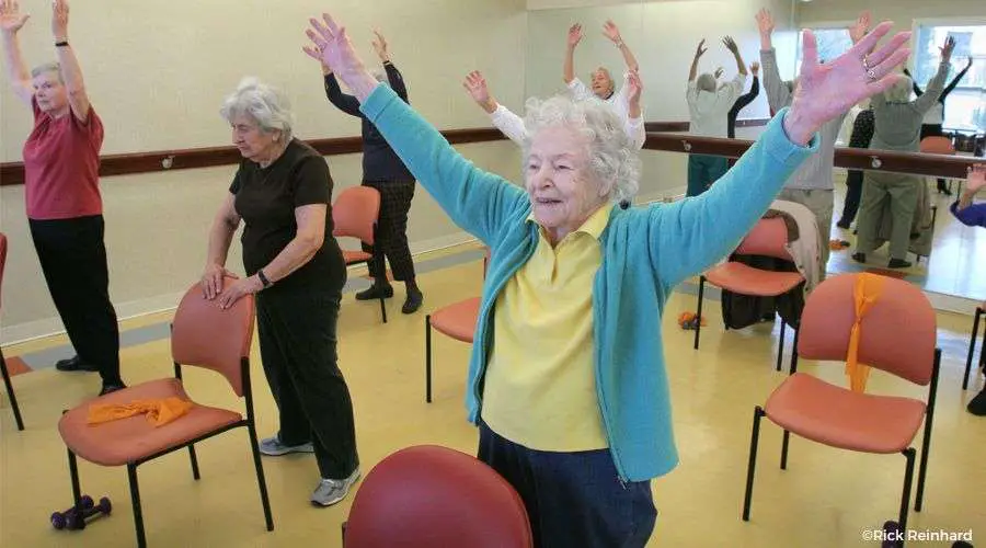 Seniors doing light exercises