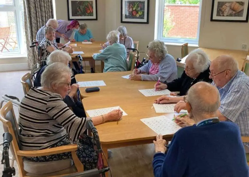 Elderly people gathered for a table Game