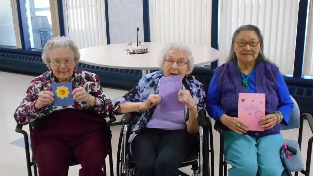 Seniors presenting their love notes during Love Note Day in Aged Care