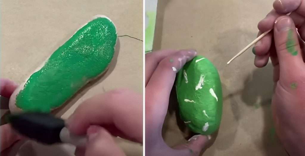Painting rock with green paint