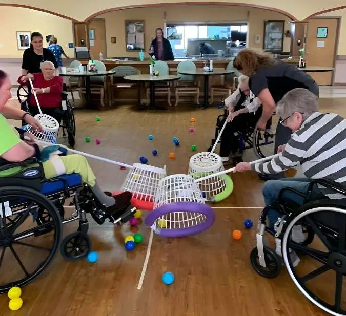 seniors in wheelchair playing Hungry Hippos