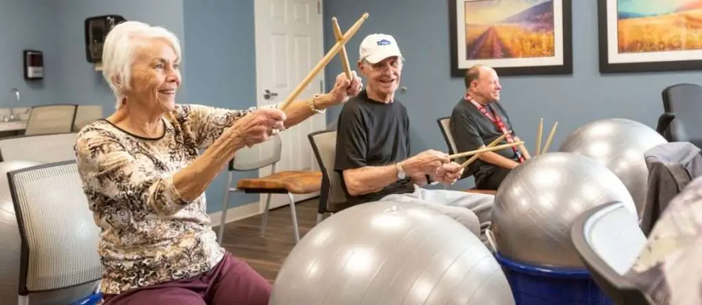 elders doing drumming exercises
