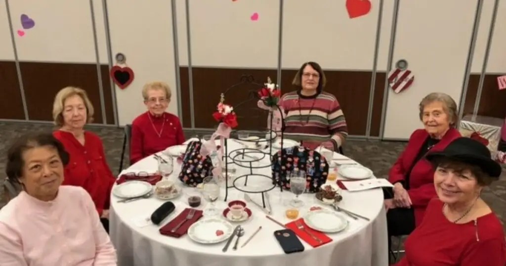 Elderly women dressed in Valentine's day themed shirts