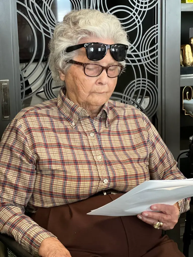 elderly woman reading famous phrases quiz