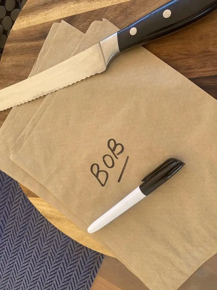 paper bag with "Bob" labeled on it