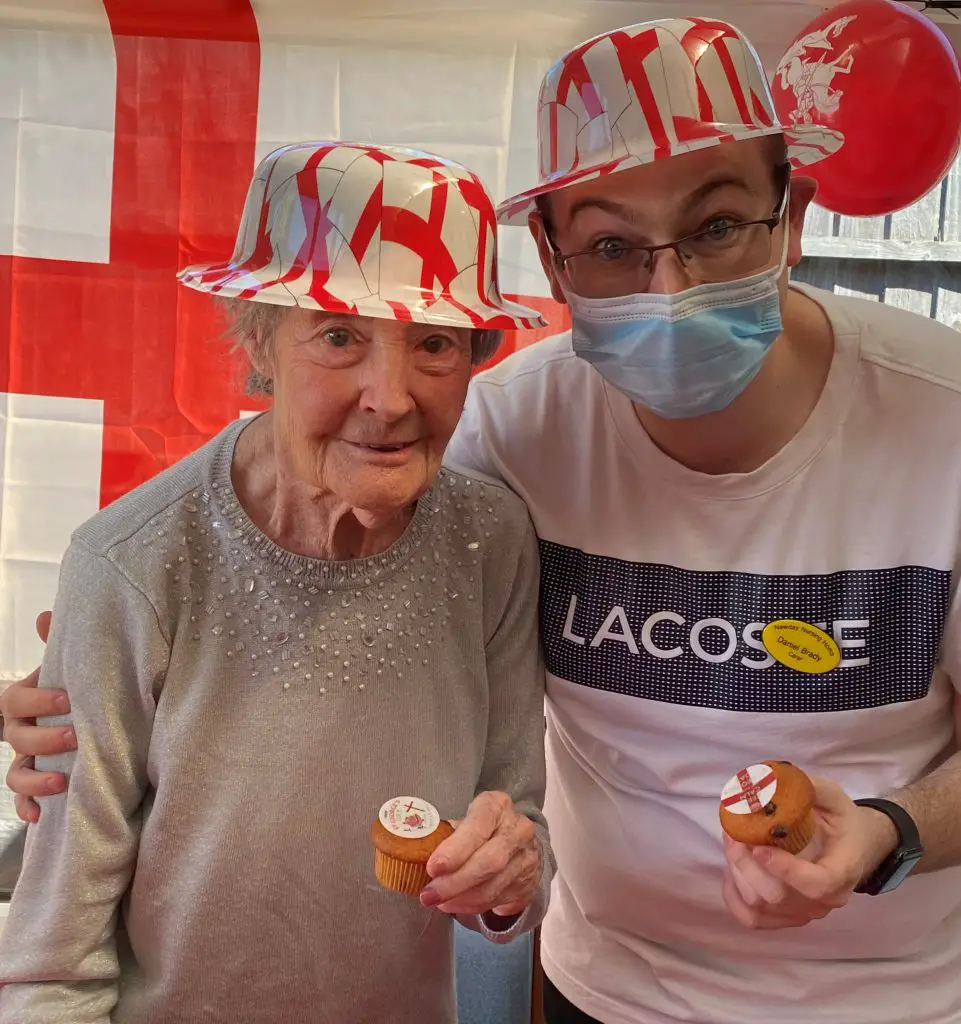 Grandma and aged care staff taking picture during St. George's Day celebration