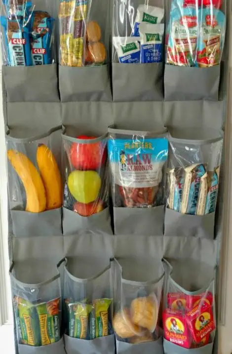a hanging pocket organizer with healthy snacks