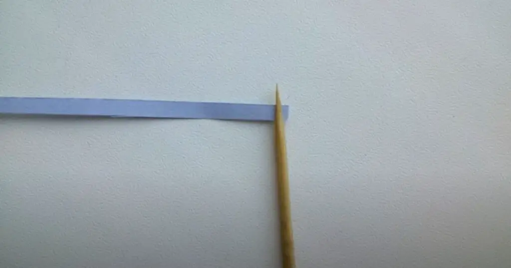 paper strip attached to stick