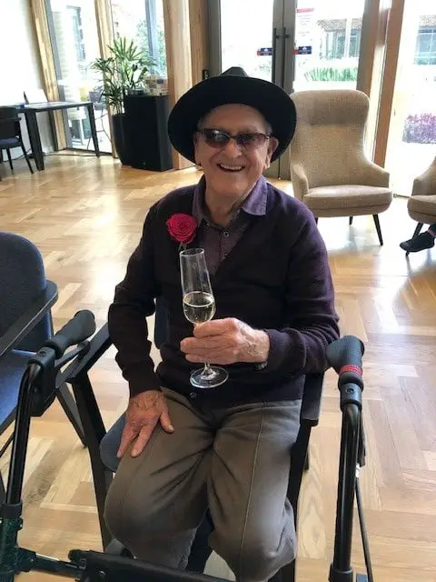 dressed up senior man in aged care