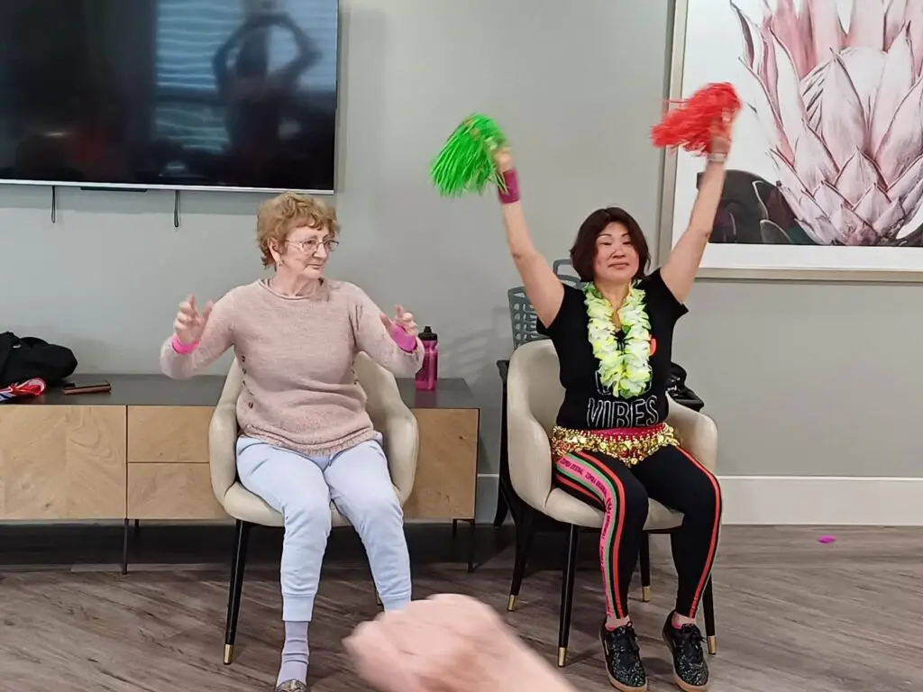 two elderly ladies cheering