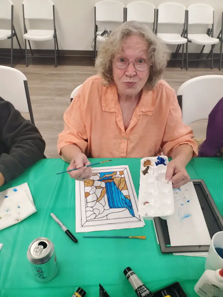 Elderly woman doing Faux Stained Glass