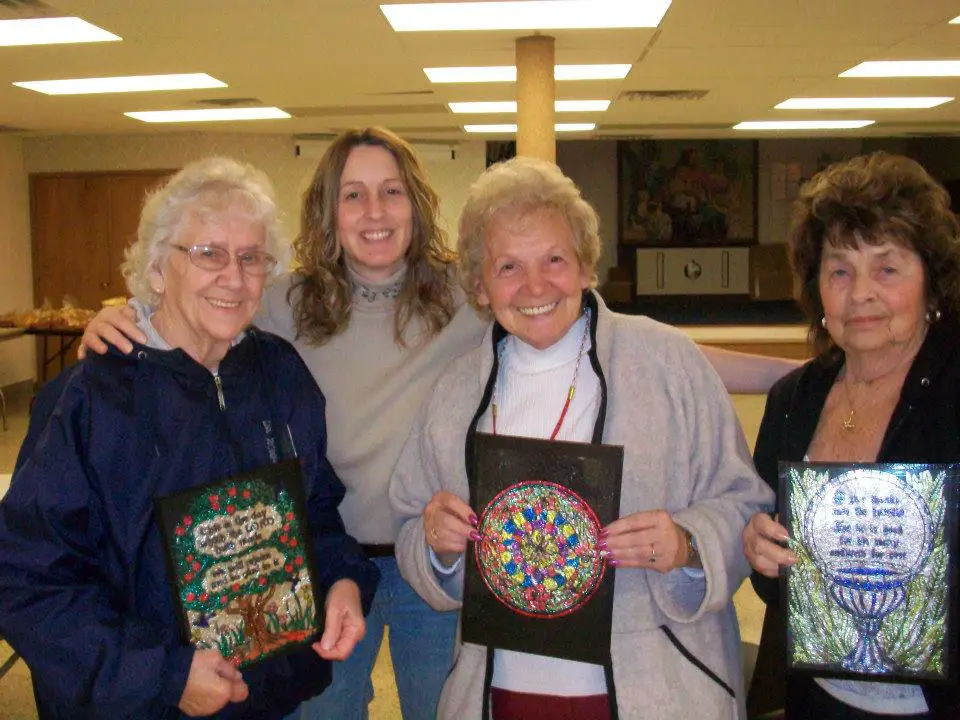 Aged care residents displaying their faux stained glass output