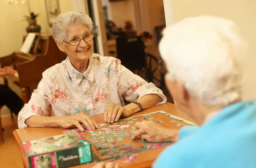 seniors playing jigsaw puzzle