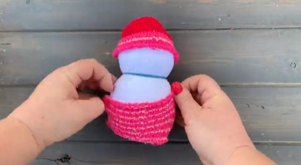 adding hat and sweater to sock snowman