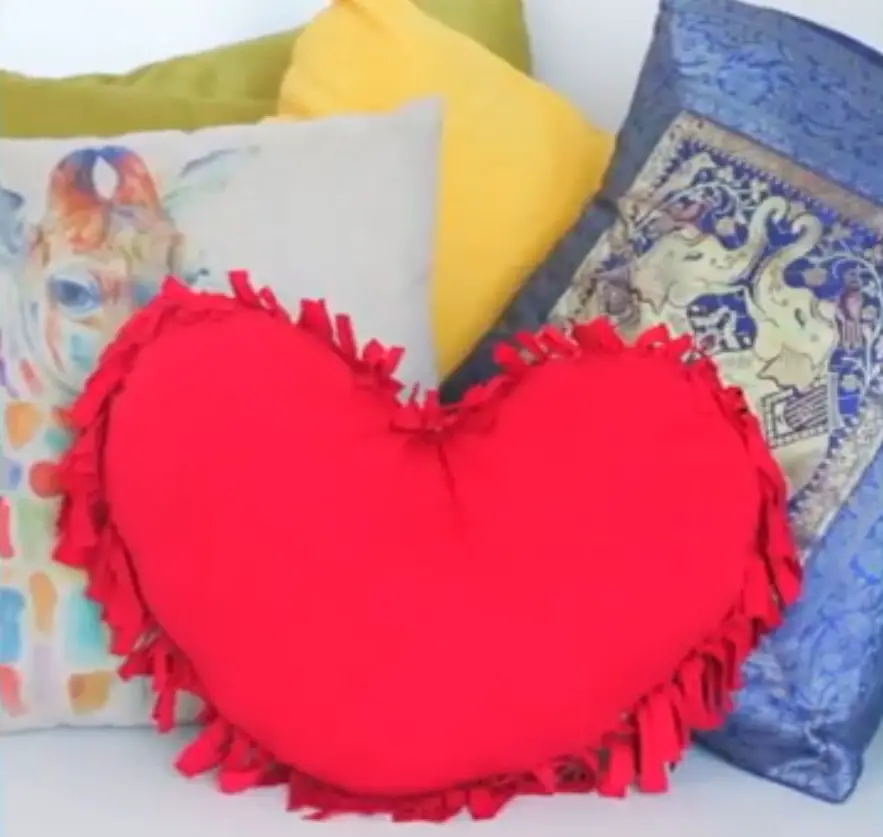 Displaying the finished product No-sew heart shaped pillow