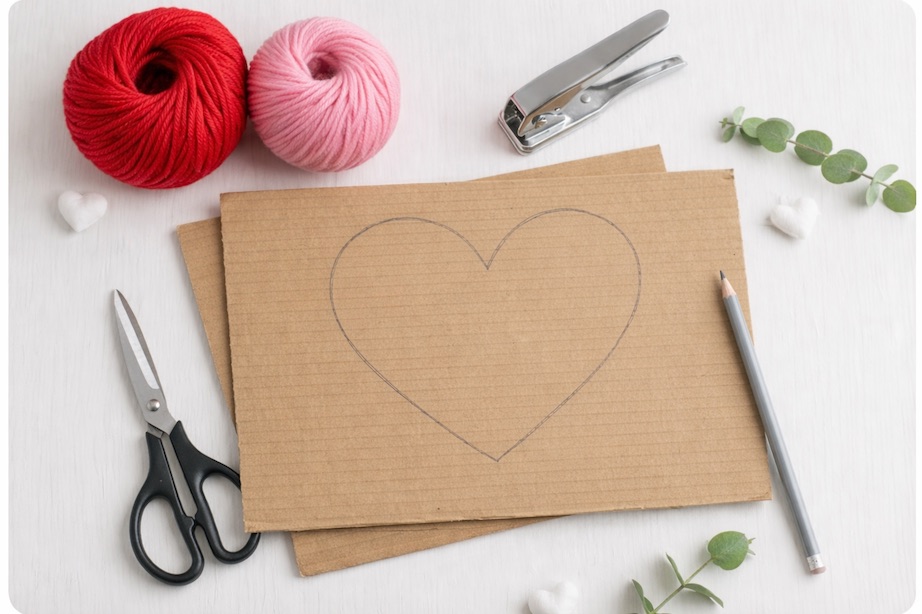 yarn, scissors and cardboard