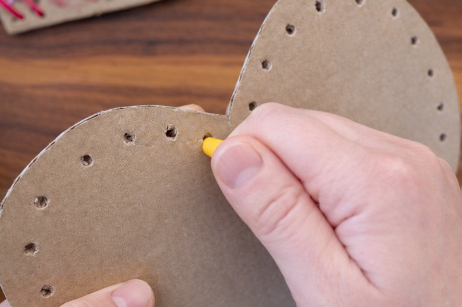 punching holes in cardboard