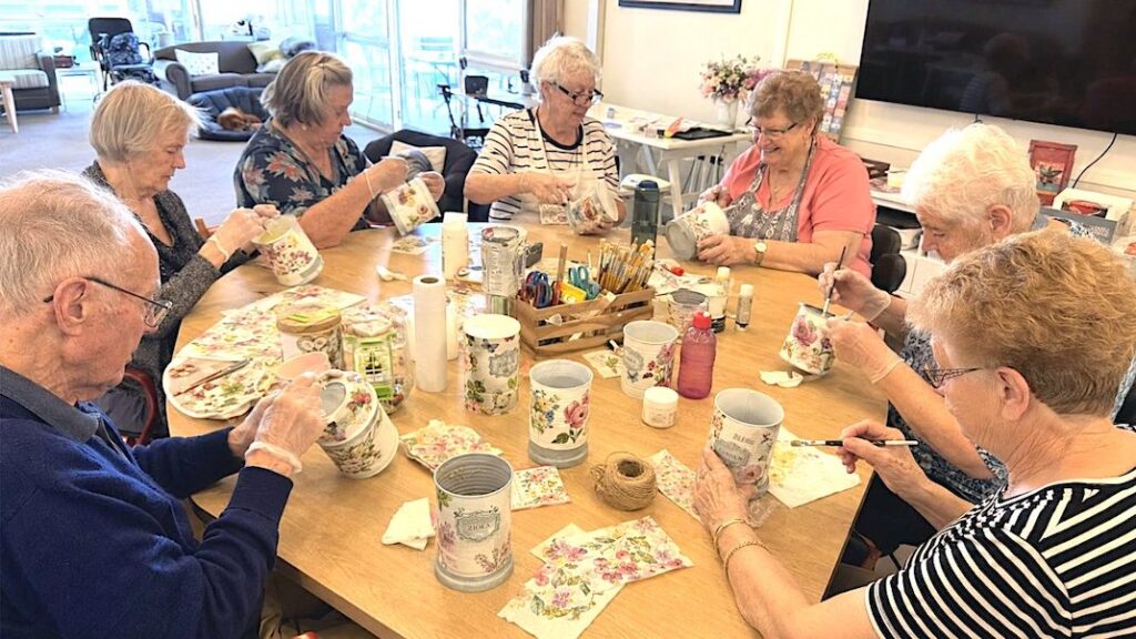 a group of seniors enjoying a crafting session