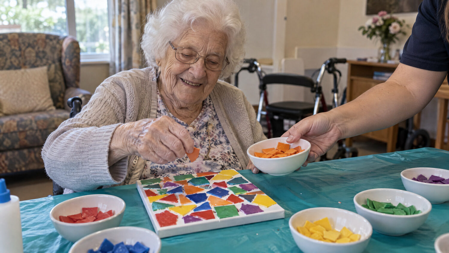 Smiling aged care resident filling a lasagne mosaic canvas with help from staff